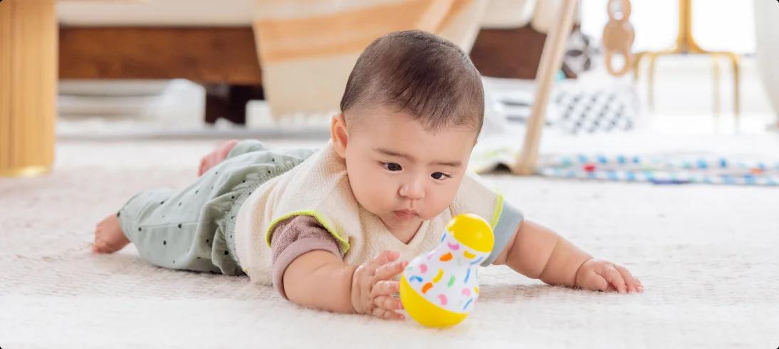 baby with tummy time wobbler